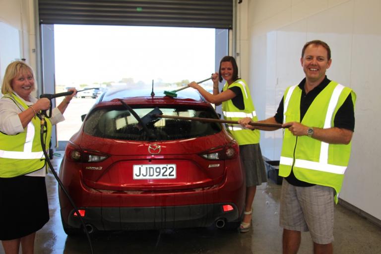 scrubbing up for business Avis Budget Group Manager Trish Goddard left and Hertz Rentals Hawkes Bay managing director Phil Cain with Hawkes Bay Airports Aeronautical and Infrastructure Manager Olivia Pierre